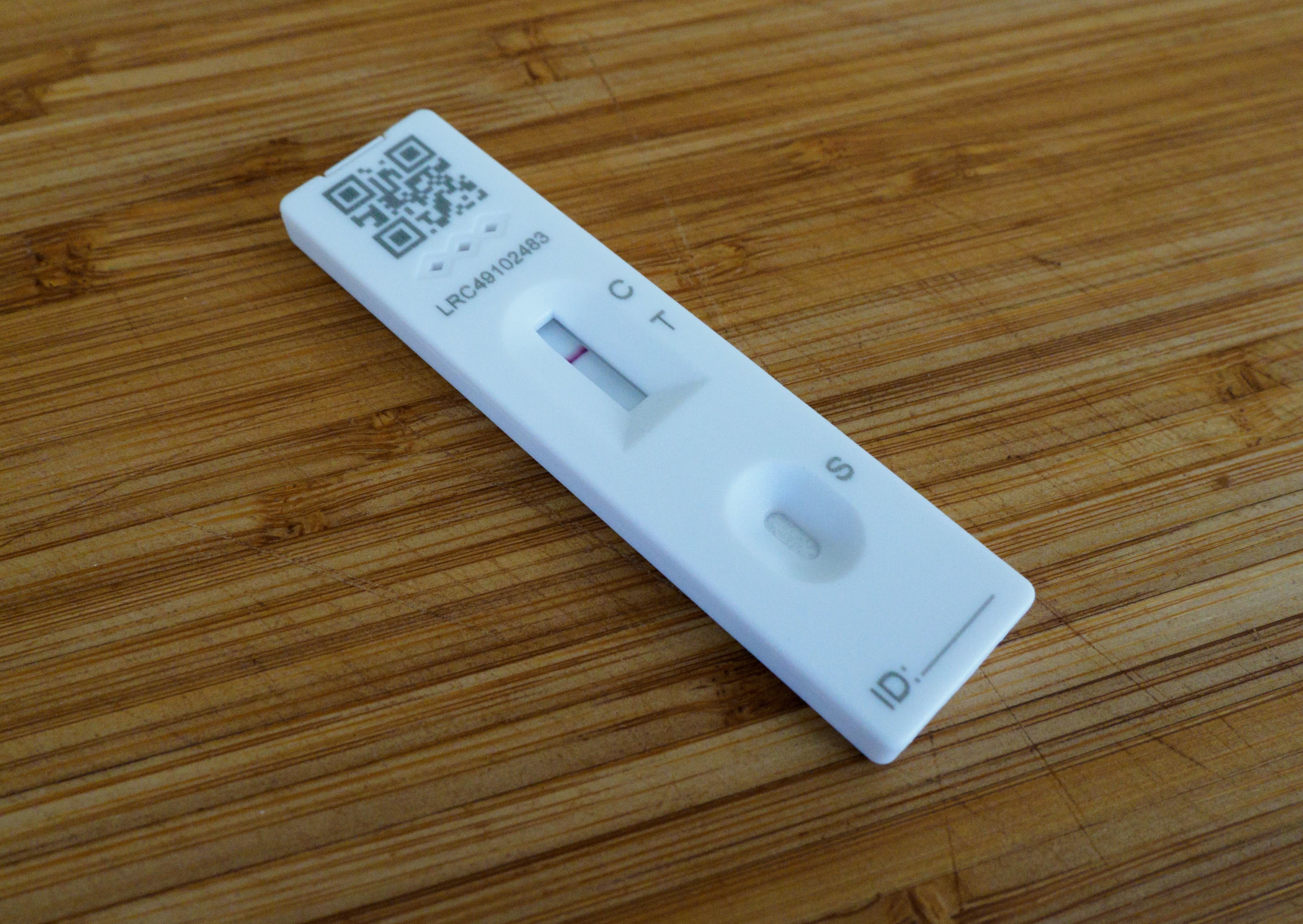 white rectangular device on brown wooden table