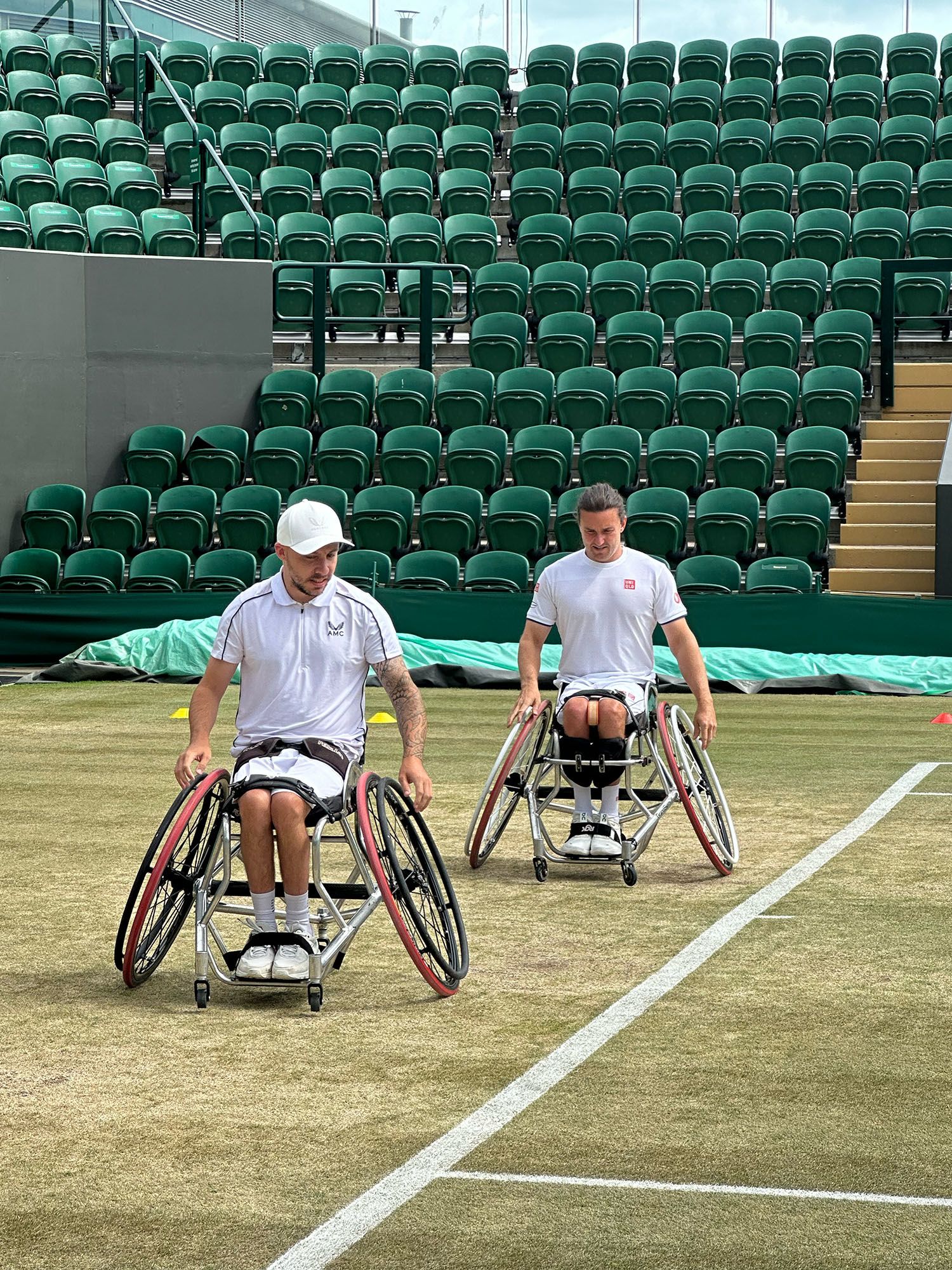 Two wheelchair tennis players on court at Wimbledon